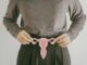 Woman hands holding uterus, female reproductive system ,PCOS, gynecologic and cervix cancer concept